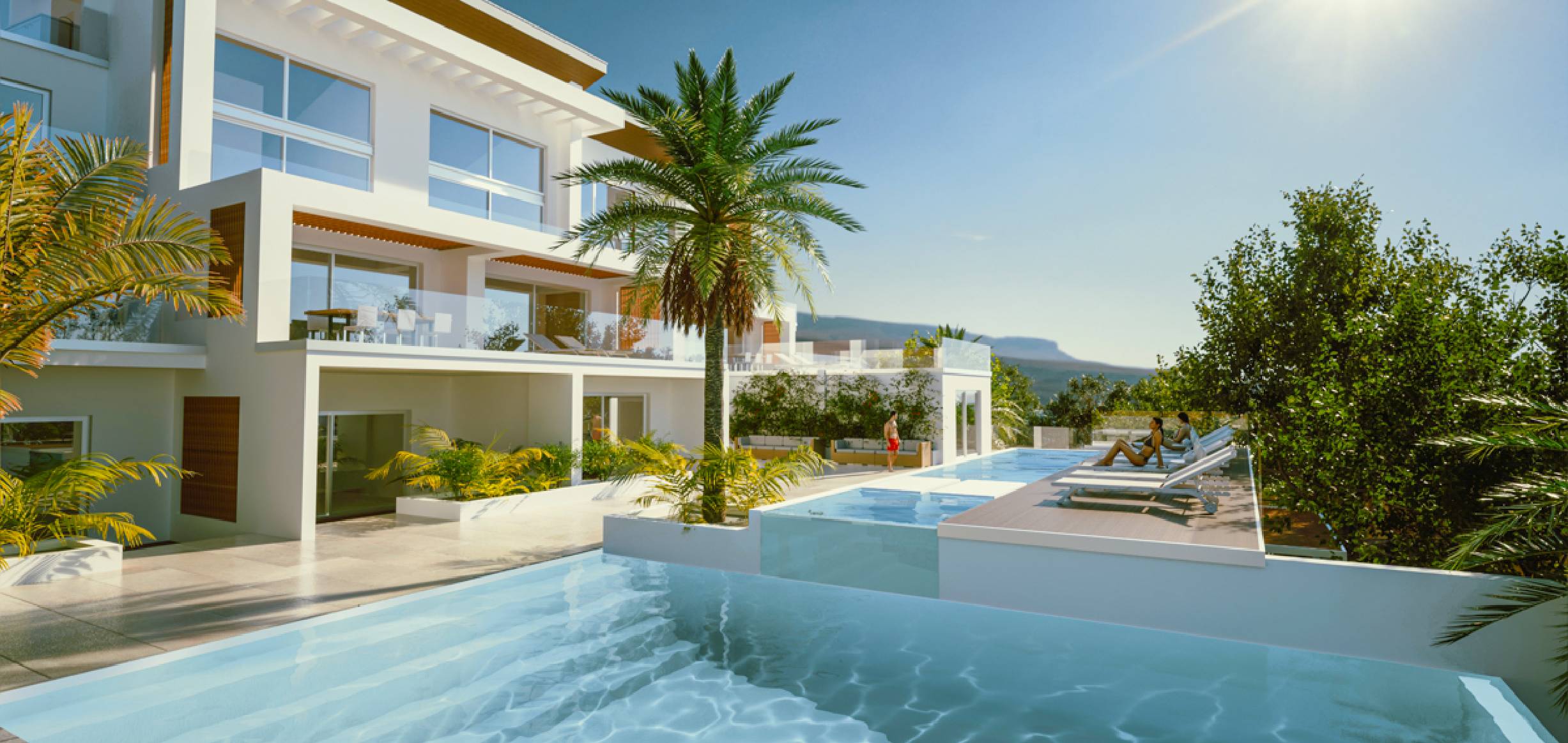 Villa in the Caribbean with blue skies and a pool terrace.