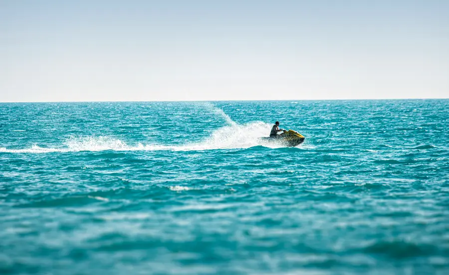 Jet ski on turquoise water.