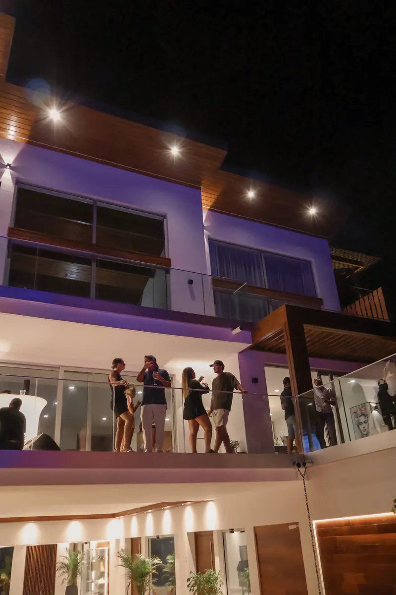 Guests on the terraces of Aura during an evening event.